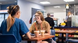 Two students studying in coffee shop