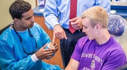 Student athlete fitting a mouthguard at DI