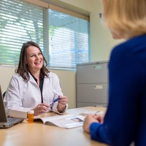 Multispecialty clinic doctor showing test results to a patient