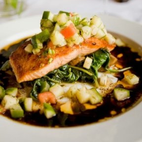 Salmon dish with broth and veggies.