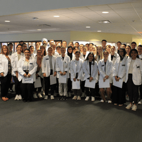 Group photo of the Physical Therapy students, faculty, and staff, prior to the interdisciplinary activity.