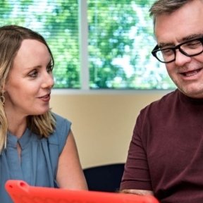 Speech language pathologist works with patient with aphasia.