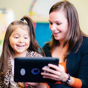 Child learning to read on a tablet.