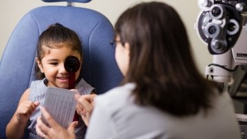 Young girl having an eye examination.