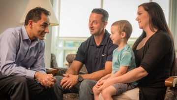 Child with his parents having a discussion with a clinical psychologist