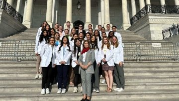 CCOM stand outside Capitol Hill