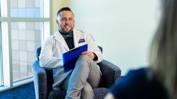 Student listening to patient talk