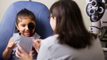 Young girl having an eye examination.