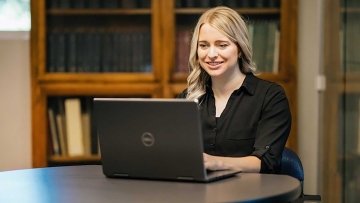 Young woman working on a laptop.