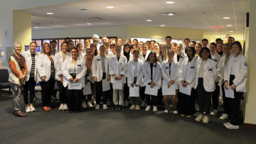 Group photo of the Physical Therapy students, faculty, and staff, prior to the interdisciplinary activity.