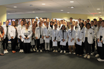 Group photo of the Physical Therapy students, faculty, and staff, prior to the interdisciplinary activity.