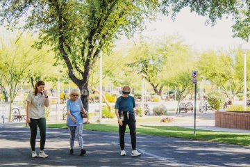 Sharon walks with students at Midwestern University Glendale Campus