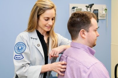 Dr. McKinnon performs an exam on a patient.