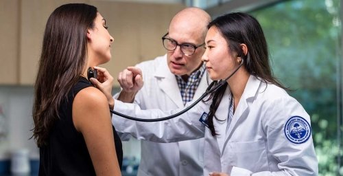 doctor, student, examining patient