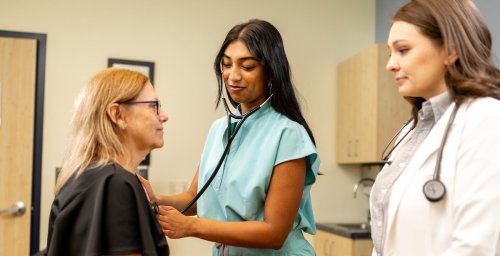 doctor, student, examining patient