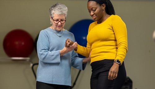 Patient doing exercise activities with physical therapist.