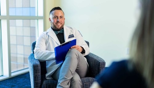 Student listening to patient talk