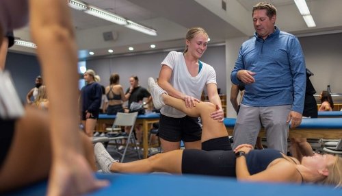 Students working in physical therapy lab.