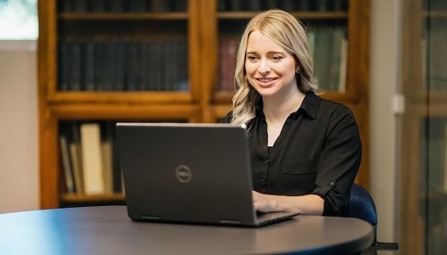 Young woman working on a laptop.