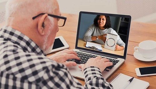 Older gentleman using a laptop.