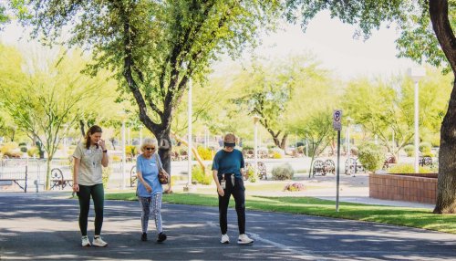 Sharon walks with students at Midwestern University Glendale Campus