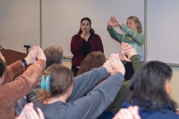 Attendees participate in an exercise to figure out their dominant eye.